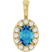 14K Yellow 6x4 mm Natural Blue Zircon & 1/10 CTW Natural Diamond Halo-Style Pendant