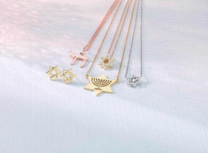 Custom rose gold Chai necklace, diamond Star of David pendants, Menorah necklace, and gold stud earrings crafted by master jewelers at Motek Jewelry in Rockland County, NY.