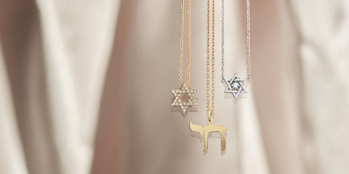 Custom yellow gold Chai necklace and diamond-paved Star of David pendants crafted by master jewelers at Motek Jewelry in Rockland County, NY.
