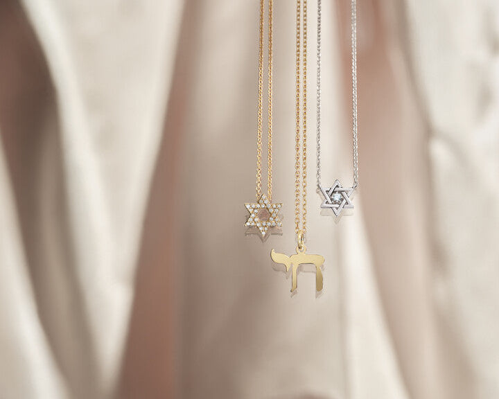 Custom yellow gold Chai necklace and diamond-paved Star of David pendants crafted by master jewelers at Motek Jewelry in Rockland County, NY.