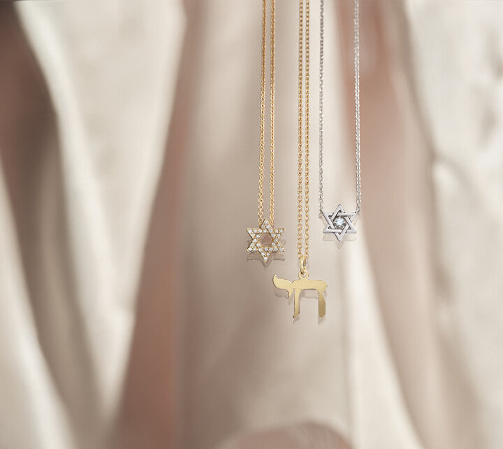 Custom yellow gold Chai necklace and diamond-paved Star of David pendants crafted by master jewelers at Motek Jewelry in Rockland County, NY.